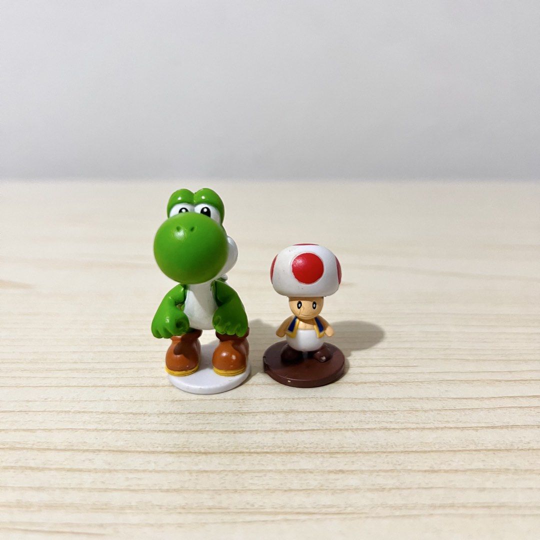 Super Mario Yoshi and Toad Mini Figures height: 3-4.5cm - Php 100 each NOTE: w/ small paint chips (Category: Character Goods) located in Davao. Submitted by pandorastoybox (Listing ID 1469495314, Image 1). Description: Super Mario Yoshi and Toad Mini Figures height: 3-4.5cm - Php 100 each NOTE: w/ small paint chips.
