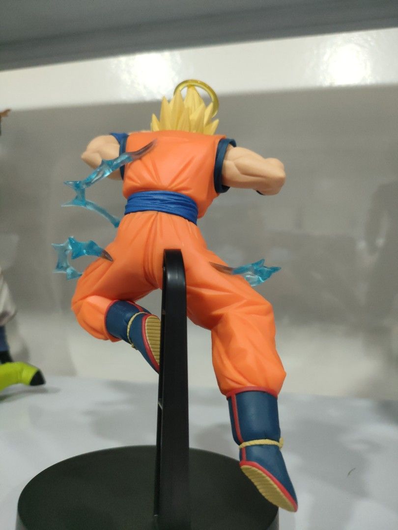 Super Saiyan 2 Son Goku (Category: Figurines & Statues) located in Bulacan. Submitted by hunterherojapanjdm (Listing ID 1469475399, Image 2). Description: Banpresto Dragon Ball Z Match Makers Super Saiyan 2 Son Goku (vs. Majin Vegeta) figure. It stands approximately 15 cm tall and features Goku with his signature halo and dynamic blue energy effect parts..