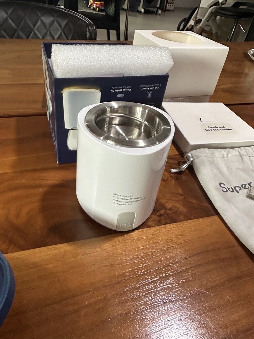 Supermama Lab Portable Milk Warmer 2.0 with Adapters (Category: Breastfeeding & Bottle Feeding) located in Manila. Submitted by zoelion (Listing ID 1469405541, Image 1). Description: Supermama Lab Milk Warmer 2.0 (Like New) - Cordless, wireless design ideal for feeding on-the-go - Convenient USB-C charging - Unboxed only to check contents, never used outdoors - Includes original box and protective storage pouch - Comes with charging cable and ful