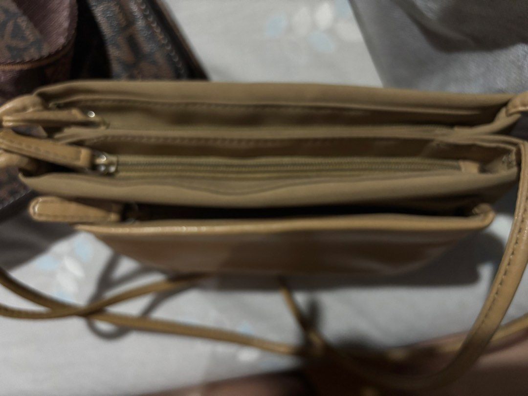 Tan brown multi-compartment shoulder crossbody bag (Category: Cross-body Bags) located in Manila. Submitted by cleverdog_2c1729 (Listing ID 1469513641, Image 2). Description: - Color: Versatile tan brown that matches any outfit - Storage: Multiple zipped compartments to keep your essentials organized - Strap: Slim, comfortable shoulder strap for easy wear - Capacity: Ideal everyday size for phone, keys, and wallet - Condition: Brand new and ready
