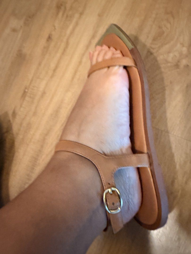 Tan Flat Sandals Square Toe with Gold Toe Cap Size (Category: Flats & Sandals) located in Makati City. Submitted by schelaloo (Listing ID 1469401407, Image 3). Description: - Color: Tan with metallic gold toe caps - Design: Unique square toe and secure ankle strap with buckle closure - Condition: Worn a few times with minimal signs of wear, super clean and ready to wear - Style: Comfortable flat sole, ideal for daily casual outings.