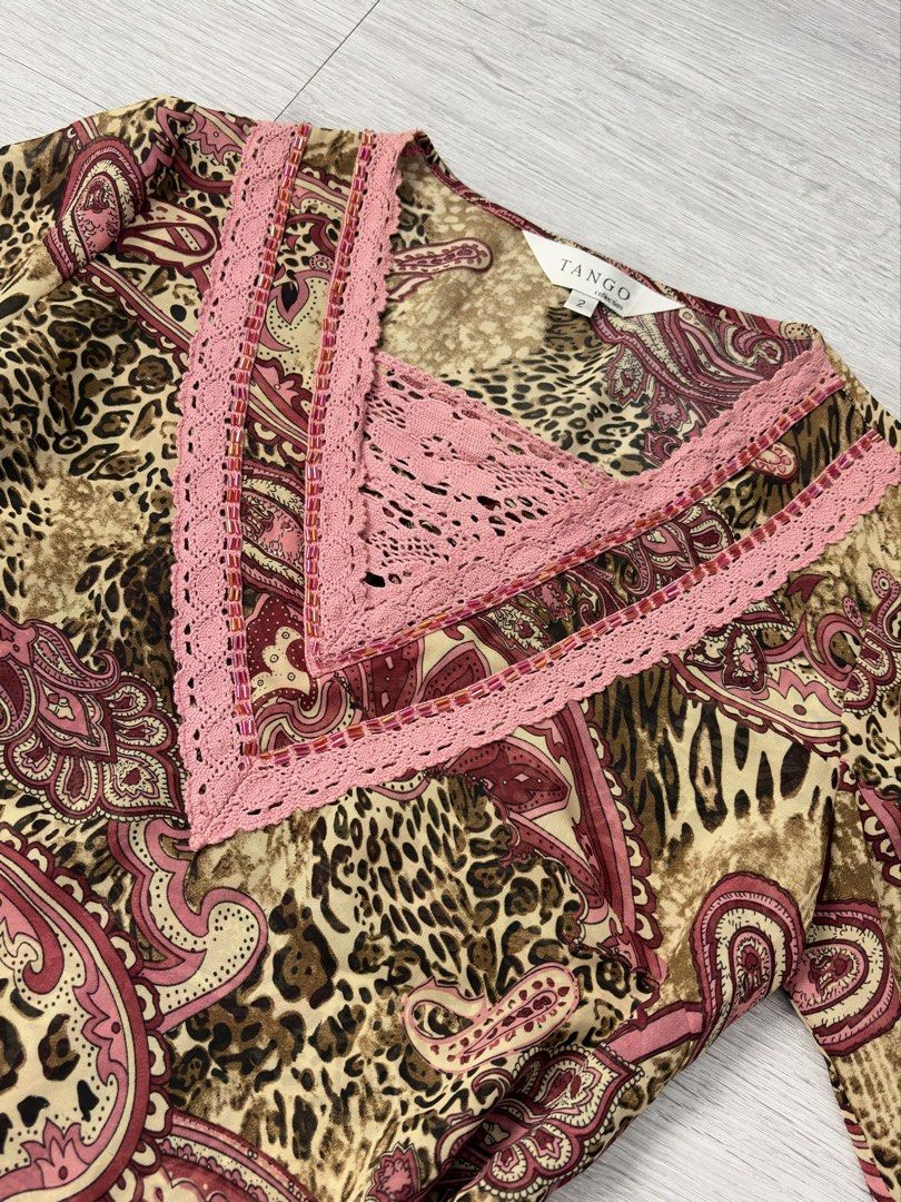 Tango Collection Leopard Paisley Print Blouse (Category: Blouses) located in Manila. Submitted by silentwhale_543e69 (Listing ID 1469483166, Image 3). Description: Vintage Y2K TANGO Collection Boho Paisley & Leopard Lace Trim Top Selling this gorgeous archival/vintage long sleeve top from the TANGO collection. Dets: -mix of leopard/cheetah animal print and pink paisley -layered V-neckline detailed with pink crochet lace trim and pink and gold bug