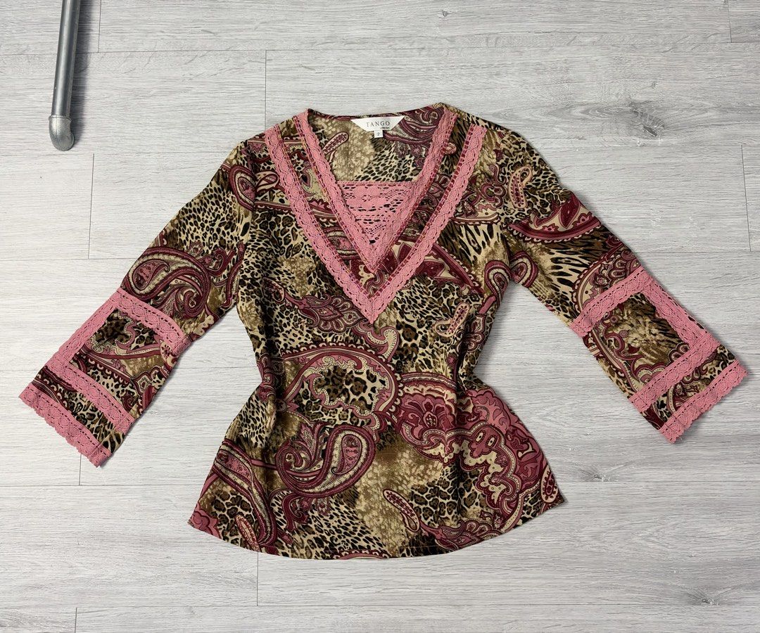 Tango Collection Leopard Paisley Print Blouse (Category: Blouses) located in Manila. Submitted by silentwhale_543e69 (Listing ID 1469483166, Image 2). Description: Vintage Y2K TANGO Collection Boho Paisley & Leopard Lace Trim Top Selling this gorgeous archival/vintage long sleeve top from the TANGO collection. Dets: -mix of leopard/cheetah animal print and pink paisley -layered V-neckline detailed with pink crochet lace trim and pink and gold bug