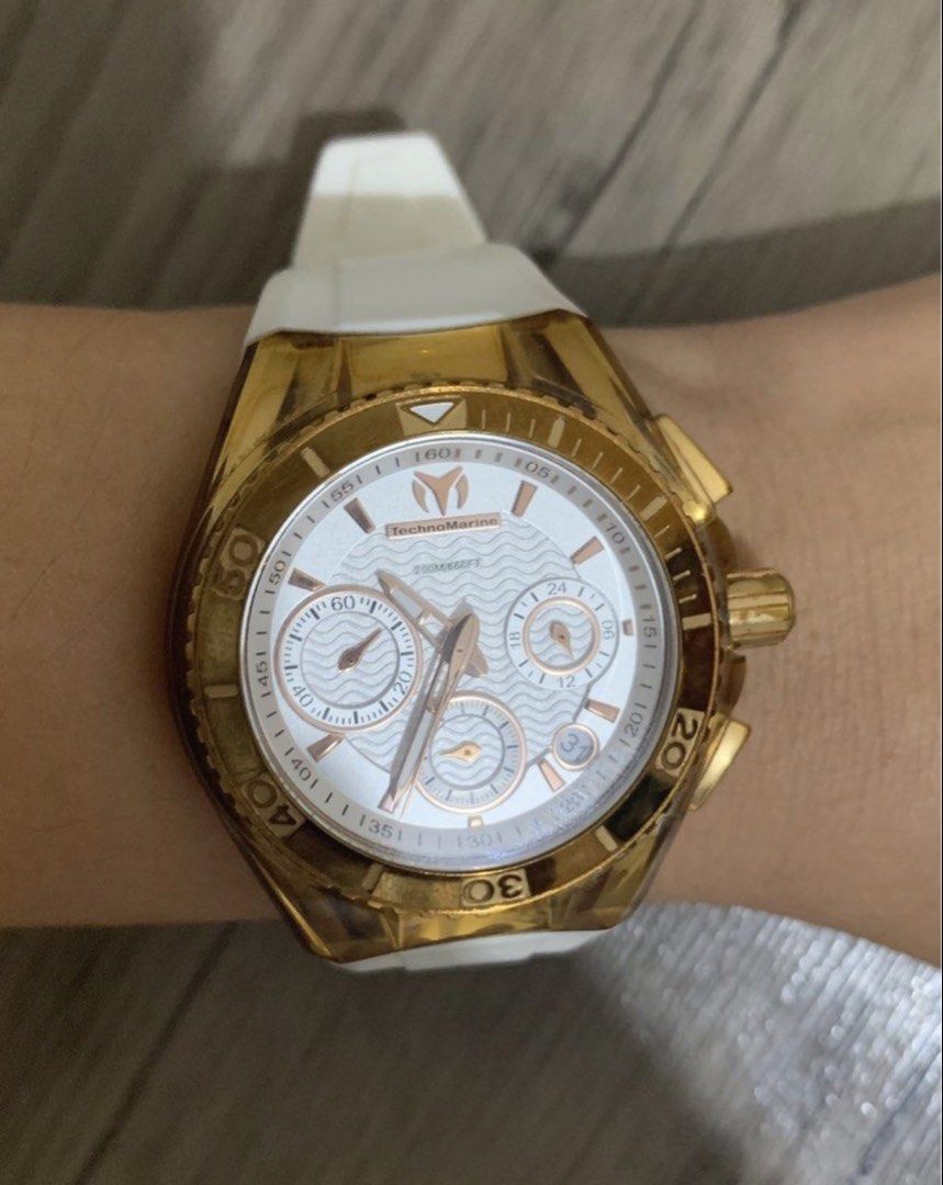 TechnoMarine Chronograph Watch Gold White (Category: Women's Watches) located in Dumaguete. Submitted by freshcornerbyyeng (Listing ID 1469412992, Image 1). Description: - Brand: TechnoMarine - Style: Chronograph, sporty yet dressy everyday timepiece - Case & Buckle: Striking gold-tone with brand logo on the buckle - Dial: Textured white dial with clearly visible subdials and date window - Strap: Comfortable white silicone strap - Water Resistanc
