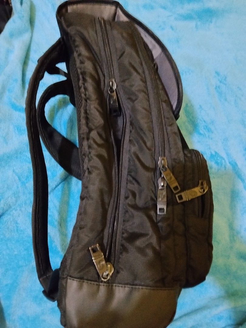Technopack Black Backpack with Multiple Pockets and Buckles (Category: Backpacks) located in Manila. Submitted by rjzon (Listing ID 1469511462, Image 2). Description: Original Technopack backpack - Bought from SM for 2.1k pesos. Can give for 900-1.1k negotiable - Brand/Model: Technopack Black Backpack - Storage: Front zipper pockets, dual buckle straps over the flap, and multiple side and back compartments - Comfort: Equipped with padded shoulder