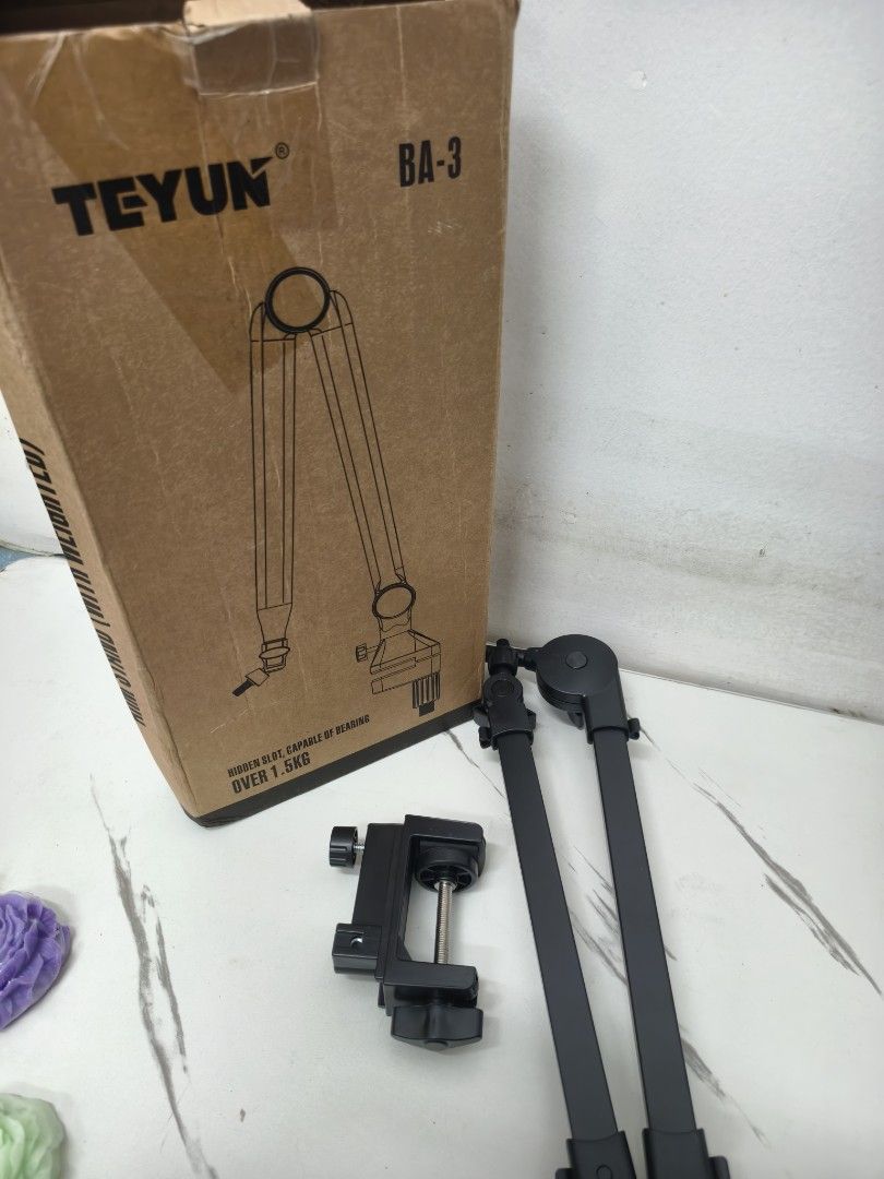 TEYUN BA-3 Microphone Arm Stand (Category: Microphones) located in Angeles City. Submitted by measaliman02351 (Listing ID 1469537613, Image 3). Description: - Model: TEYUN BA-3 microphone suspension boom arm - Color/Material: Sleek black metal construction - Weight Capacity: Sturdy design supports over 1.5kg - Inclusions: Includes adjustable arm, desk mounting clamp, and original box - Ideal Use: Perfect for streaming, podcasting, and voice recor