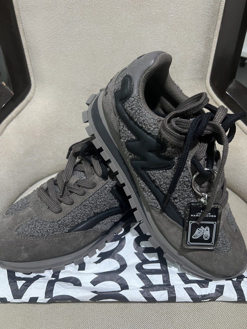 The Jogger Marc Jacobs Teddy Sneakers Size 39 (Category: Sneakers) located in Manila. Submitted by trustedceller (Listing ID 1469476527, Image 2). Description: - Brand: Marc Jacobs (The Jogger) - Color: Dark grey - Size: EU 39/ Size US 8 Runs small, best fit to US 7.5 - Condition: Brand new / Zero wear on soles - Materials: Textured fleece upper with suede and smooth leather overlays - Features: Chunky rubber tread sole with lettering underneath,