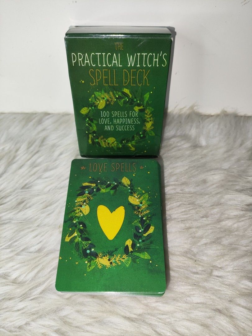 The Practical Witch's Spell Deck 100 Spells (Category: Storybooks) located in Cavite. Submitted by tinetaclesss (Listing ID 1469498673, Image 1). Description: - Title: The Practical Witch's Spell Deck (Green edition) - Contents: 100 spells focused on love, happiness, and success - Design: Features charming illustrated botanical borders and unique titles (e.g., Goddess Body Blessing Balm, Enchanted Lips, Elixir of Love) - Condition: Comes in its o