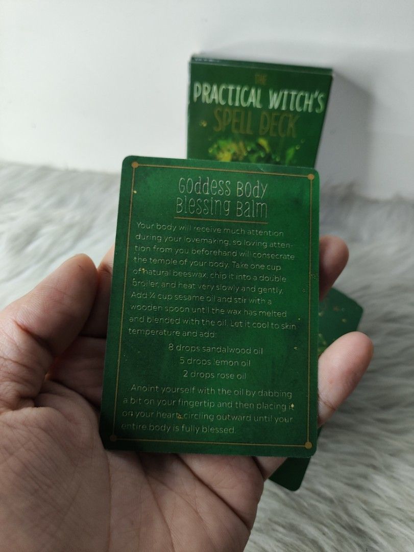The Practical Witch's Spell Deck 100 Spells (Category: Storybooks) located in Cavite. Submitted by tinetaclesss (Listing ID 1469498673, Image 2). Description: - Title: The Practical Witch's Spell Deck (Green edition) - Contents: 100 spells focused on love, happiness, and success - Design: Features charming illustrated botanical borders and unique titles (e.g., Goddess Body Blessing Balm, Enchanted Lips, Elixir of Love) - Condition: Comes in its o