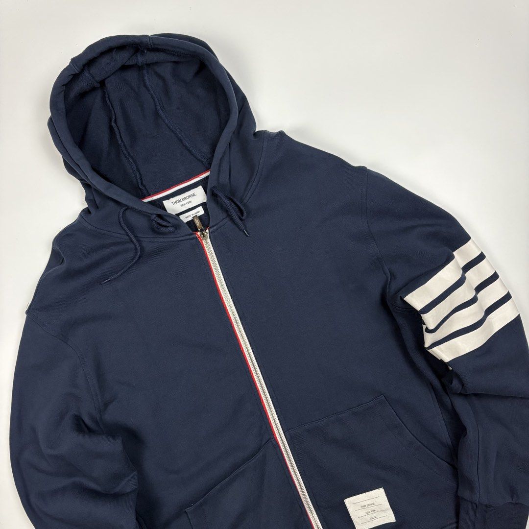 Thom Browne classic loopback 4-bar zip up hoodie (Category: Luxury Apparel) located in Quezon City. Submitted by 1106_collective (Listing ID 1469464811, Image 3). Description: Size: 4 Condition: 9.5/10 Material: 100% Cotton Made in: Japan Flaw / Defect: None Dimension Width: 21” Length: 26.5 Shoulder: 20” Sleeve: 25”.