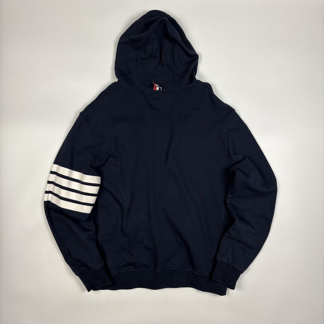 Thom Browne classic loopback 4-bar zip up hoodie (Category: Luxury Apparel) located in Quezon City. Submitted by 1106_collective (Listing ID 1469464811, Image 2). Description: Size: 4 Condition: 9.5/10 Material: 100% Cotton Made in: Japan Flaw / Defect: None Dimension Width: 21” Length: 26.5 Shoulder: 20” Sleeve: 25”.