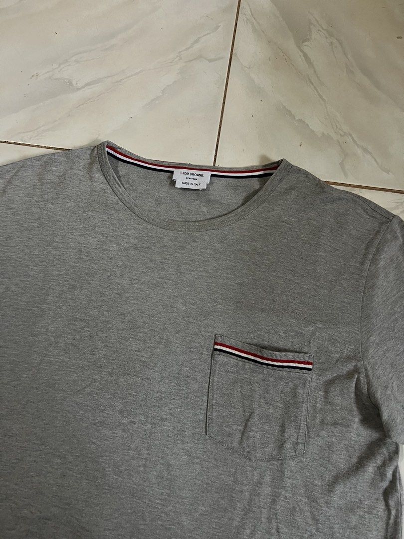Thom Browne Pocket Tee (Category: Tshirts & Polo Shirts ) located in Iloilo. Submitted by deric.john93 (Listing ID 1469457220, Image 2). Description: size 2 on tag medium fits 20 x 27.5 no flaws like new condition 9.8/10 color rate Authentic 💯 1800.
