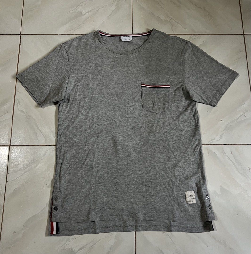 Thom Browne Pocket Tee (Category: Tshirts & Polo Shirts ) located in Iloilo. Submitted by deric.john93 (Listing ID 1469457220, Image 1). Description: size 2 on tag medium fits 20 x 27.5 no flaws like new condition 9.8/10 color rate Authentic 💯 1800.