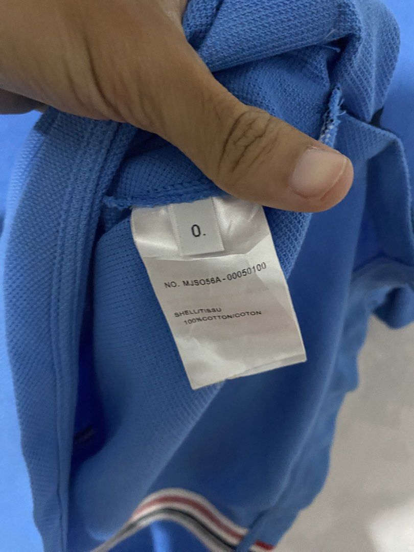 Thom Browne Relaxed Fit short sleeve (Category: Tshirts & Polo Shirts ) located in Bulacan. Submitted by _myarchive (Listing ID 1469451031, Image 3). Description: - Brand: Thom Browne - Color: Light Blue - Condition excellent - Material: 100% cotton piqué (Made in Italy) - Fit: Relaxed fit - Details: Crew neck, ribbed trims, functional buttons at the hem with signature tricolor grosgrain placket -may needwash na dumi lang na onti.