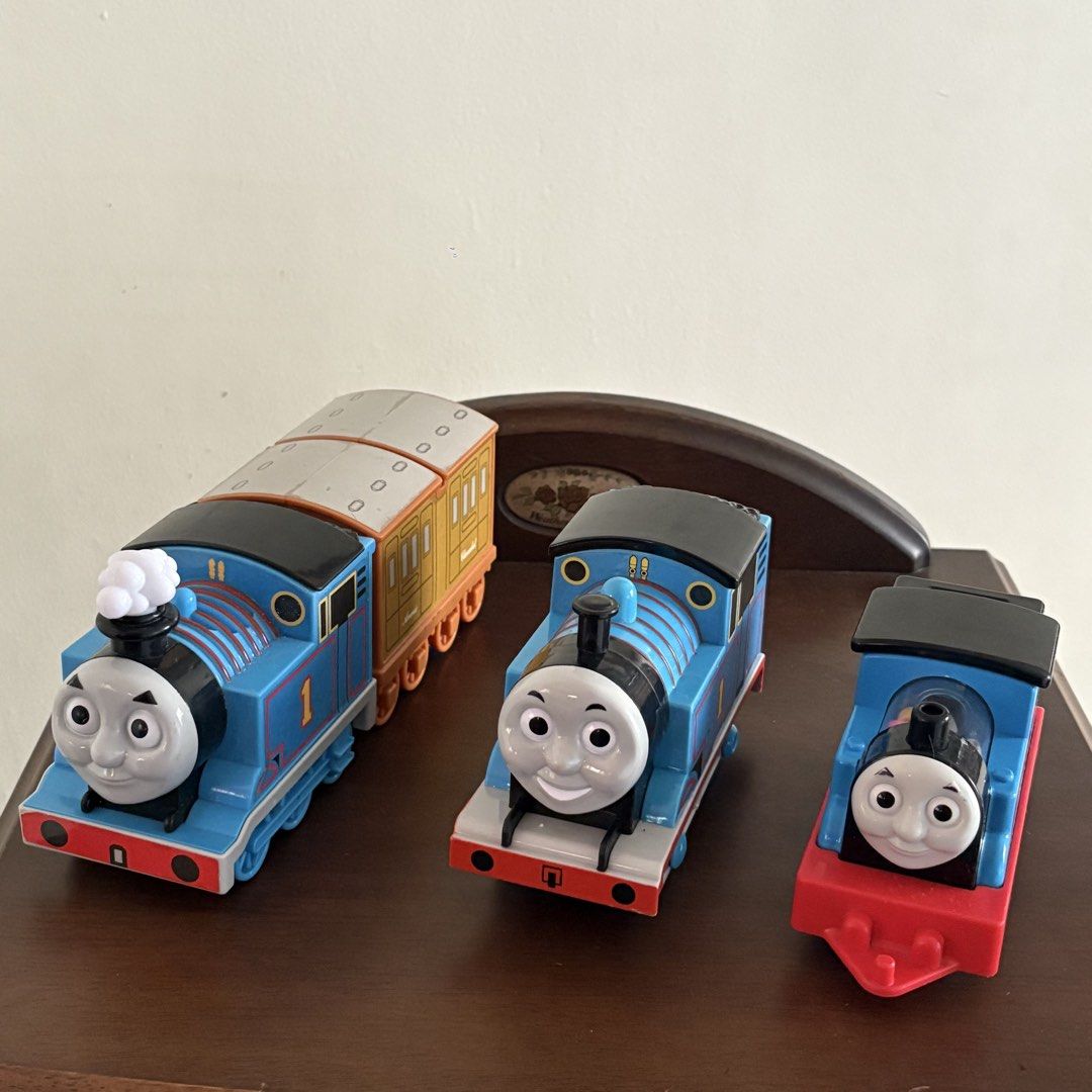 Thomas & Friends Toy Trains Lot (Category: Vehicle & Diecast Models) located in Manila. Submitted by aobacafe (Listing ID 1469453490, Image 1). Description: - Lot of 3 Thomas the Tank Engine toy trains for fans of all ages - Large motorized engine with smoke effect and two brown coach cars included - Medium motorized engine featuring the number 1 on the side - Small push-along engine with a clear boiler filled with colorful beads - Features durab
