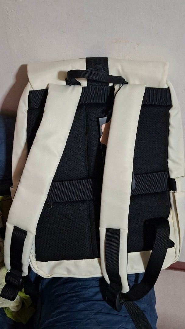 Tigernu Off-White Laptop Backpack (Category: Backpacks) located in Maragondon. Submitted by thatgirlpibi (Listing ID 1469535284, Image 2). Description: Tigernu brand backpack in off-white color with black straps and buckle closure. Includes original tag attached. Multiple compartments with zipper closures on the front flap and body. Padded black mesh back panel and comfortable shoulder straps. Designed to fit a 14-inch laptop. Made of Oxford mate