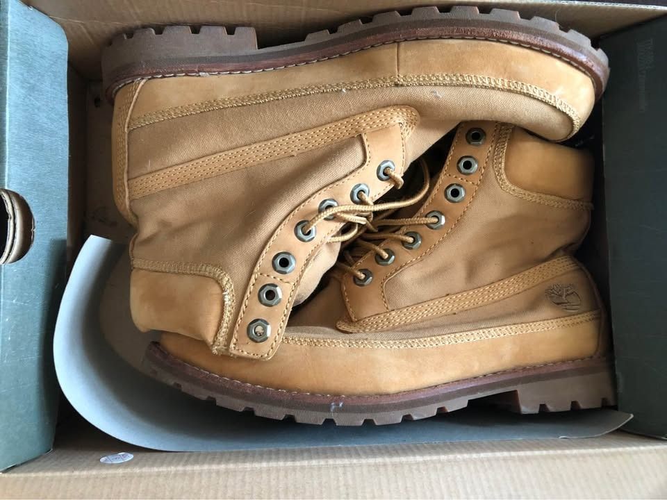 Timberland Wheat Canvas Boots (Category: Boots) located in Makati City. Submitted by binspolmat (Listing ID 1469420942, Image 1). Description: - Brand: Timberland - Material: Wheat canvas and nubuck - Condition: Great, comes with original box - Features: Classic lace-up, metal eyelets, thick lug soles, iconic heel tree logo - Style: Sturdy everyday outdoor boots, ready to wear.