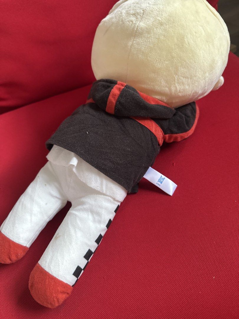TinyTAN SEGA plush toy doll BTS (Category: Plushies & Soft Toys) located in Cainta. Submitted by shopbyyna (Listing ID 1469429297, Image 2). Description: - Official TinyTAN SEGA plush toy - Blonde hair style with detailed embroidered facial features - Wearing a stylish black jacket with red trim, white pants, and sneakers - Sitting posture style with soft, clean fabric - Original tag still attached on the side - Perfect collectible item for BTS A