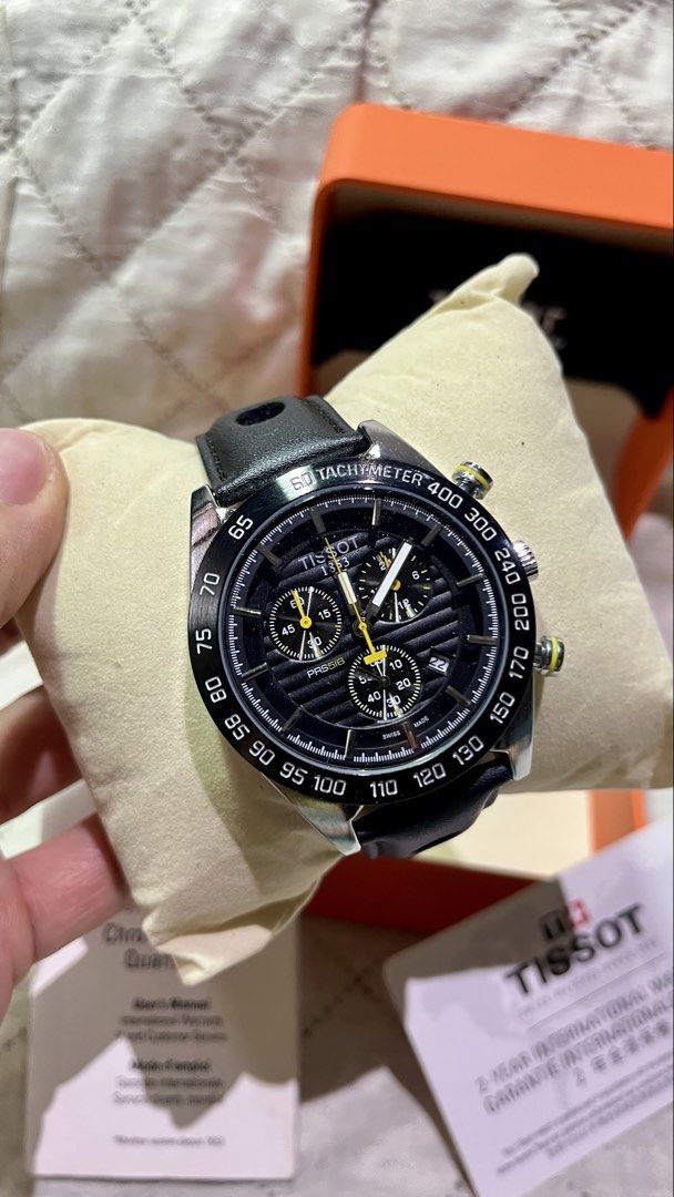 Tissot PRS 516 Chronograph (Category: Luxury Watches) located in Cebu City. Submitted by jov_146 (Listing ID 1469571793, Image 3). Description: - Brand/Model: Tissot PRS 516 Chronograph - Dial: Classic black textured dial with yellow accents and multiple chronograph sub-dials - Bezel: Black tachymeter bezel - Strap: Premium black perforated leather strap with deployment clasp featuring the Tissot logo - Inclusions: Complete with original Tissot p