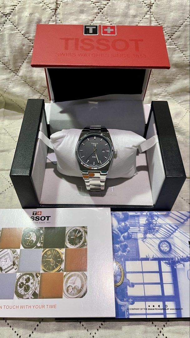 Tissot PRX Quartz Watch with Original Boxe (Category: Luxury Watches) located in Cebu City. Submitted by jov_146 (Listing ID 1469572138, Image 1). Description: - Brand: Tissot PRX Quartz Watch - Material: Stainless steel with sapphire crystal glass - Clasp: Butterfly clasp with 1853 branding - Features: Water resistant - Inclusions: Original red and black Tissot presentation box and booklet RFS : decluttering for a friend.