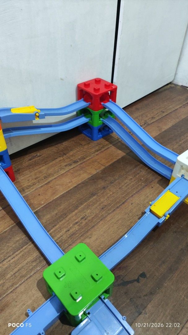 tomica playset (Category: Kids Toys) located in Quezon City. Submitted by ralphralph (Listing ID 1469538691, Image 3). Description: Multi-level plastic toy track with colorful blocks, curving blue tracks, and a black car. Perfect for hours of creative building fun!.