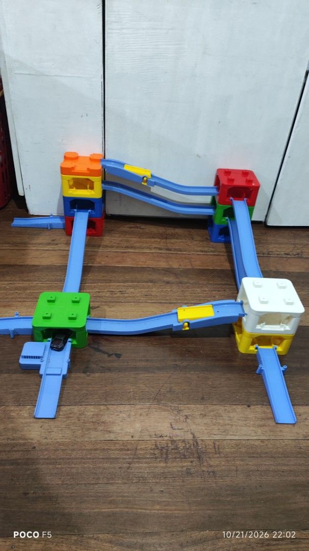 tomica playset (Category: Kids Toys) located in Quezon City. Submitted by ralphralph (Listing ID 1469538691, Image 1). Description: Multi-level plastic toy track with colorful blocks, curving blue tracks, and a black car. Perfect for hours of creative building fun!.