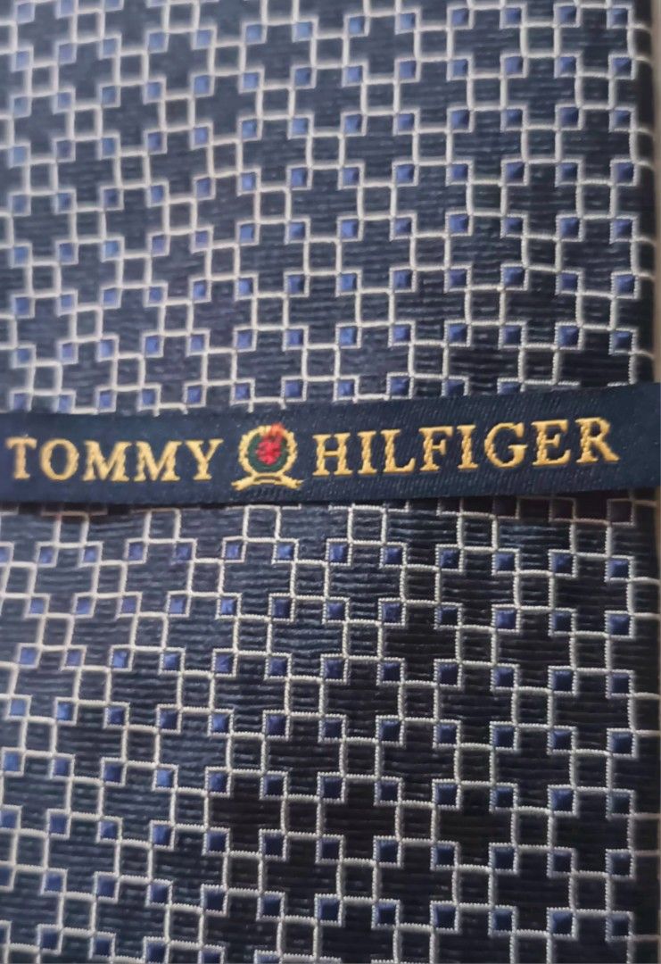 Tommy Hilfiger 100% Silk Tie w/ Geometric Pattern (Category: Ties) located in Quezon City. Submitted by happyvintage49 (Listing ID 1469553456, Image 3). Description: 📍Decluttering, NOT ukay - Brand: Tommy Hilfiger - Material: 100% imported silk (Made in USA) - Design: Classic geometric pattern in navy, grey, and light blue - Width: Standard 4 inches at widest point - Versatile use: Ideal for formal wear, office outfits - Condition: Excellent acc
