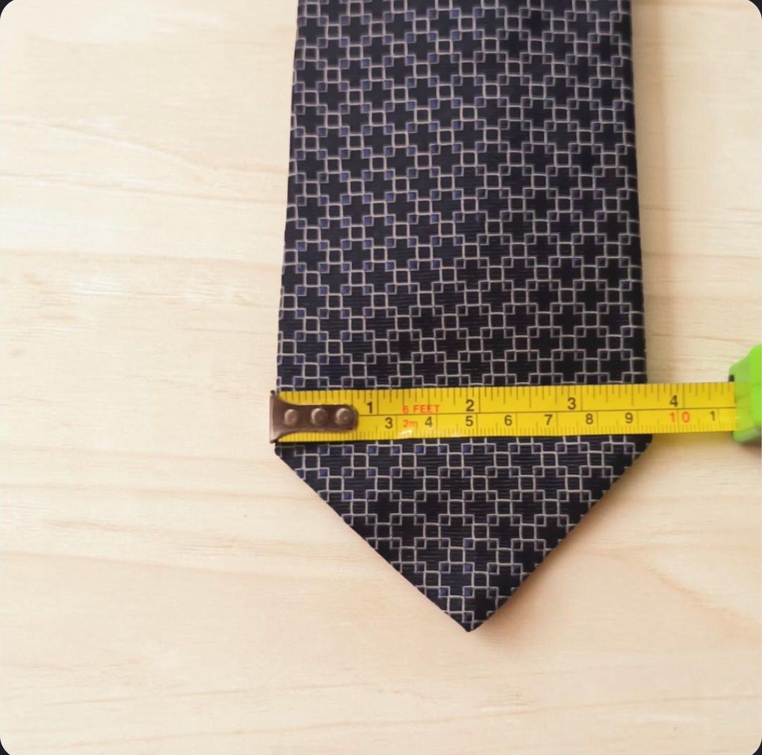 Tommy Hilfiger 100% Silk Tie w/ Geometric Pattern (Category: Ties) located in Quezon City. Submitted by happyvintage49 (Listing ID 1469553456, Image 2). Description: 📍Decluttering, NOT ukay - Brand: Tommy Hilfiger - Material: 100% imported silk (Made in USA) - Design: Classic geometric pattern in navy, grey, and light blue - Width: Standard 4 inches at widest point - Versatile use: Ideal for formal wear, office outfits - Condition: Excellent acc