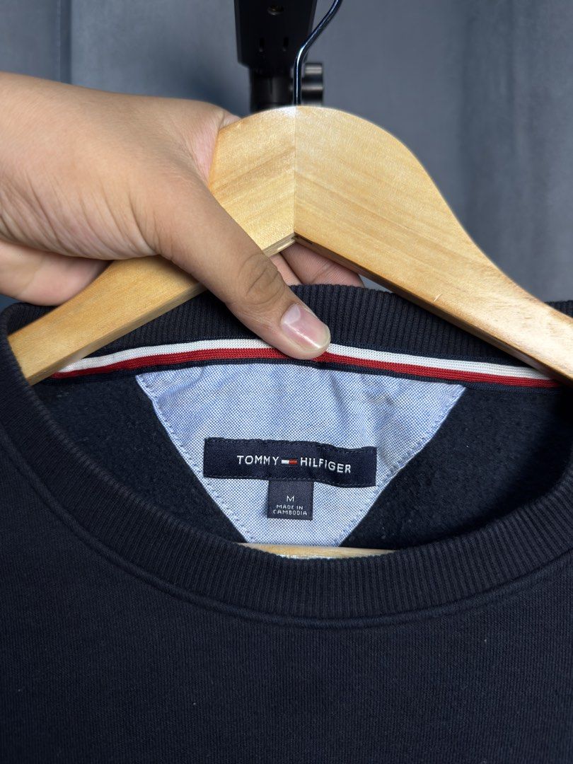 Tommy Hilfiger Crewneck Sweatshirt (Category: Coats, Jackets and Outerwear) located in Luna. Submitted by lareign (Listing ID 1469516877, Image 3). Description: -Spelled Out Brand on front -Color rate: 10/10 -Issue: None -Overall: Like New Condition -perfect for smart casual and layering .