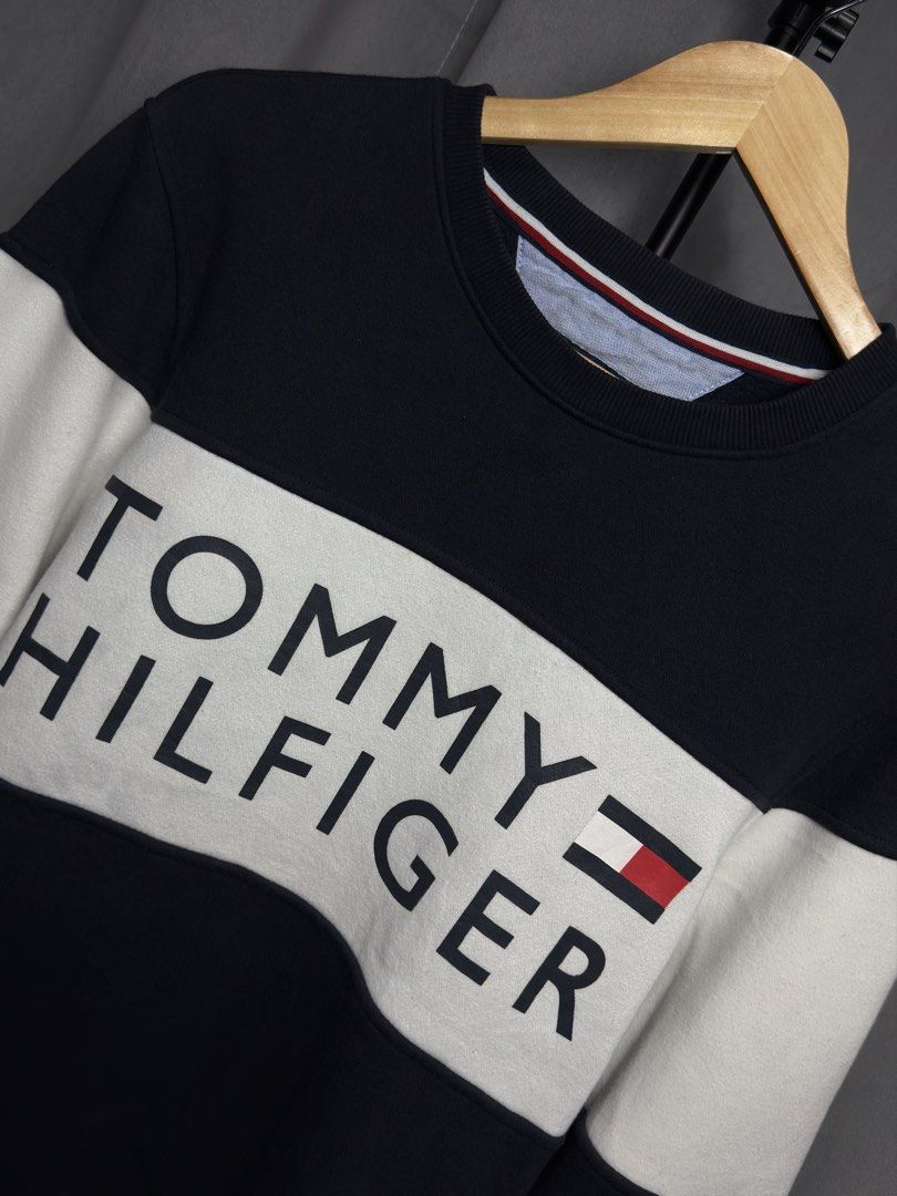 Tommy Hilfiger Crewneck Sweatshirt (Category: Coats, Jackets and Outerwear) located in Luna. Submitted by lareign (Listing ID 1469516877, Image 2). Description: -Spelled Out Brand on front -Color rate: 10/10 -Issue: None -Overall: Like New Condition -perfect for smart casual and layering .