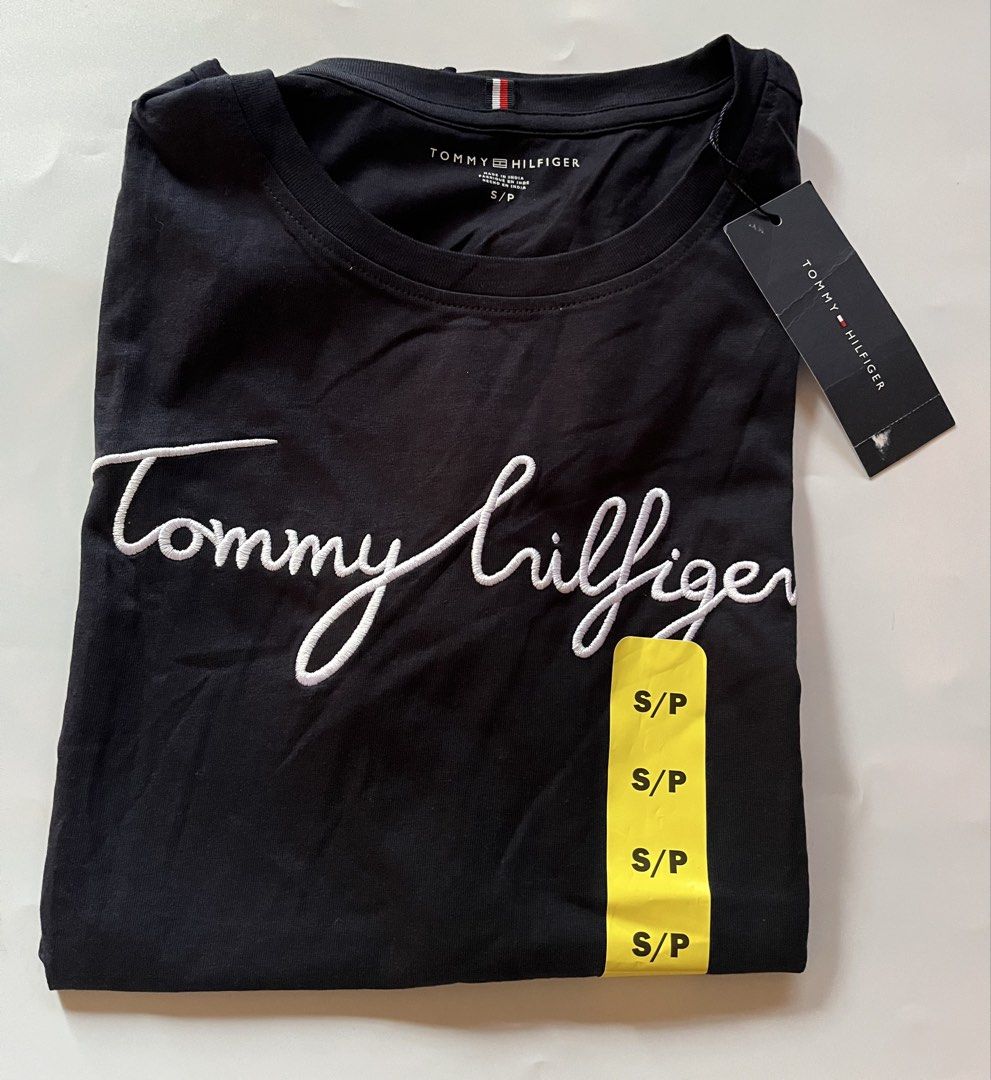 Tommy Hilfiger T-Shirts (Category: Shirts) located in Santa Rosa. Submitted by ninaparis (Listing ID 1469450602, Image 1). Description: Original Tommy Hilfiger Crewneck T-Shirt size Small with cursive embroidered Logo in black .