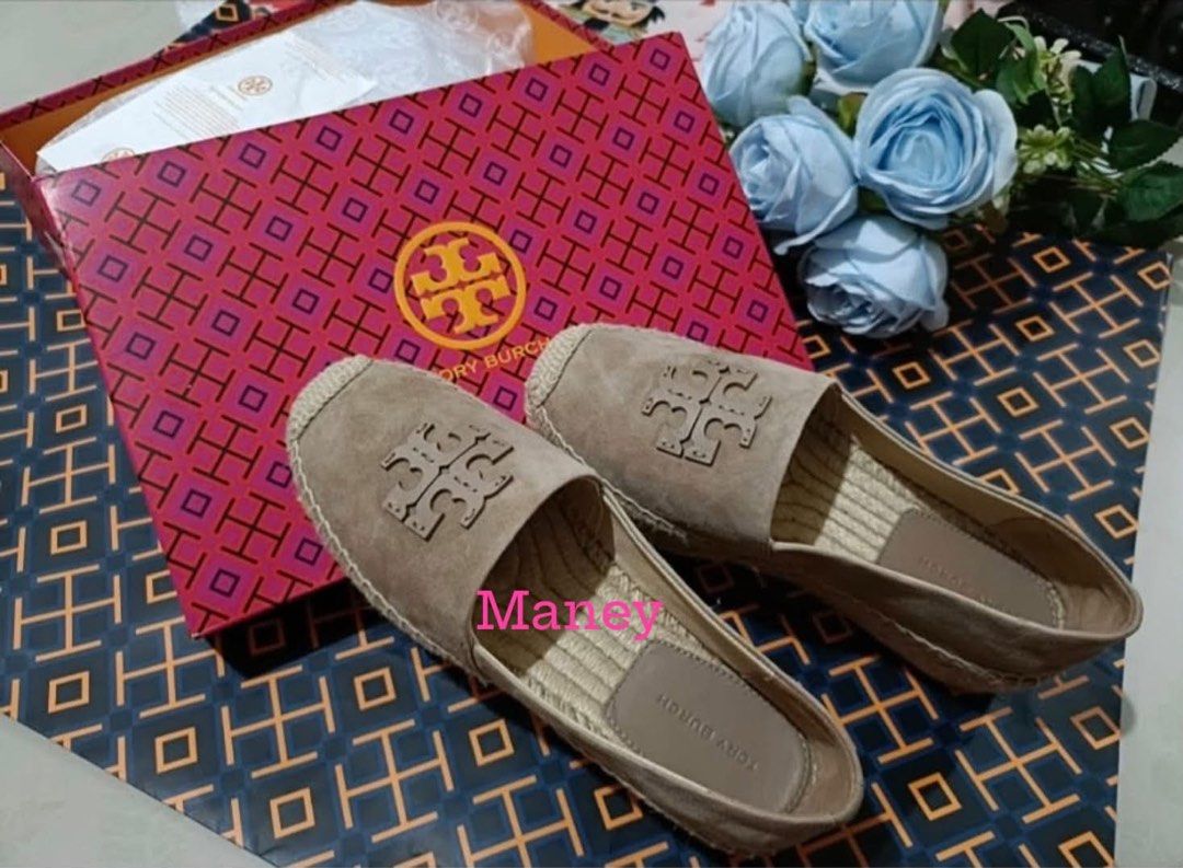 Tory Burch Taupe Espadrille Flats (Category: Flats & Sandals) located in Ozamiz City. Submitted by Maney8 (Listing ID 1469412062, Image 1). Description: - Brand: Tory Burch - Style: Taupe suede espadrille flats with slip-on design - Features: Braided jute soles and large embossed logo on top - Inclusions: Original pink patterned shoebox and matching paper bag - Condition: Excellent, guaranteed authentic - Perfect for: Casual outings, weekend styl