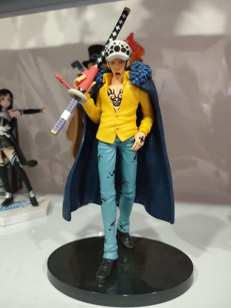 Trafalgar Law (Category: Figurines & Statues) located in Bulacan. Submitted by hunterherojapanjdm (Listing ID 1469478135, Image 1). Description: Banpresto One Piece The Shukko - Trafalgar Law figure, which depicts Trafalgar D. Water Law in his yellow shirt and blue coat outfit from the Wano Country arc..