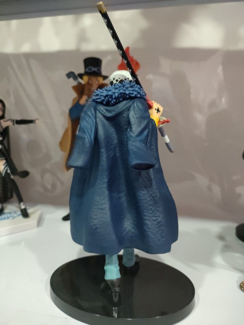 Trafalgar Law (Category: Figurines & Statues) located in Bulacan. Submitted by hunterherojapanjdm (Listing ID 1469478135, Image 2). Description: Banpresto One Piece The Shukko - Trafalgar Law figure, which depicts Trafalgar D. Water Law in his yellow shirt and blue coat outfit from the Wano Country arc..