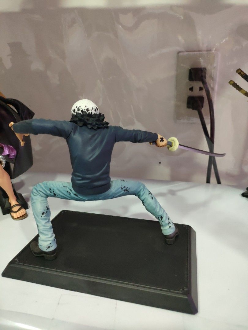 Trafalgar Law (Category: Figurines & Statues) located in Bulacan. Submitted by hunterherojapanjdm (Listing ID 1469479549, Image 2). Description: Trafalgar Law Prize D figure from the Bandai Ichiban Kuji: One Piece with One Piece Treasure Cruise line. It stands about 13.5 cm (5.3 inches) tall and depicts Law in a dynamic, low stance holding his sword..