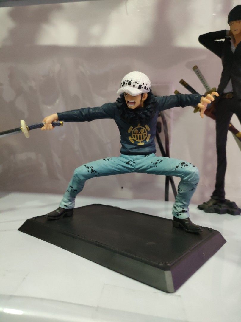 Trafalgar Law (Category: Figurines & Statues) located in Bulacan. Submitted by hunterherojapanjdm (Listing ID 1469479549, Image 1). Description: Trafalgar Law Prize D figure from the Bandai Ichiban Kuji: One Piece with One Piece Treasure Cruise line. It stands about 13.5 cm (5.3 inches) tall and depicts Law in a dynamic, low stance holding his sword..