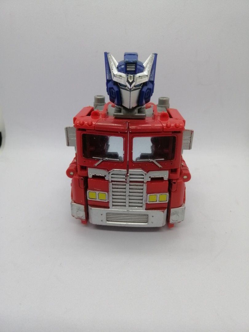 Transformer Optimus Prime red cab only (Category: Action & Battle Toys) located in Quezon City. Submitted by goldencity1964 (Listing ID 1469532492, Image 1). Description: For Transformer Optimus Prime collectors Selling this part only The RED CAB only Great for your diorama scene Scan picture please WYSIWYG AS. IS.