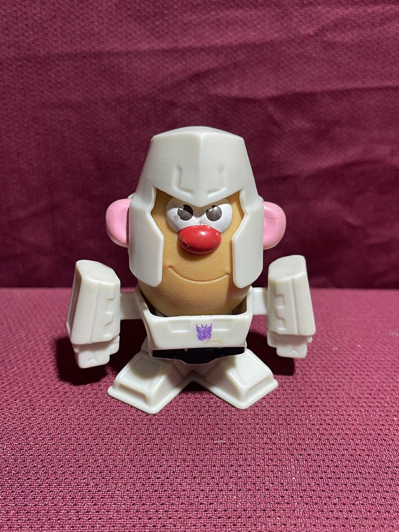 Transformers Mr. Potato Head Megatron McDonald's Toy (Category: Figurines & Statues) located in Manila. Submitted by dstrangerthings (Listing ID 1469543744, Image 1). Description: - Item: McDonald's Transformers Mr. Potato Head - Megatron - Release Year: 2022 by Hasbro - Size: Slightly taller than a standard AA battery - Features: Detachable helmet, body, and potato piece for easy disassembling - Condition: Great, fun mashup collectible for fans.