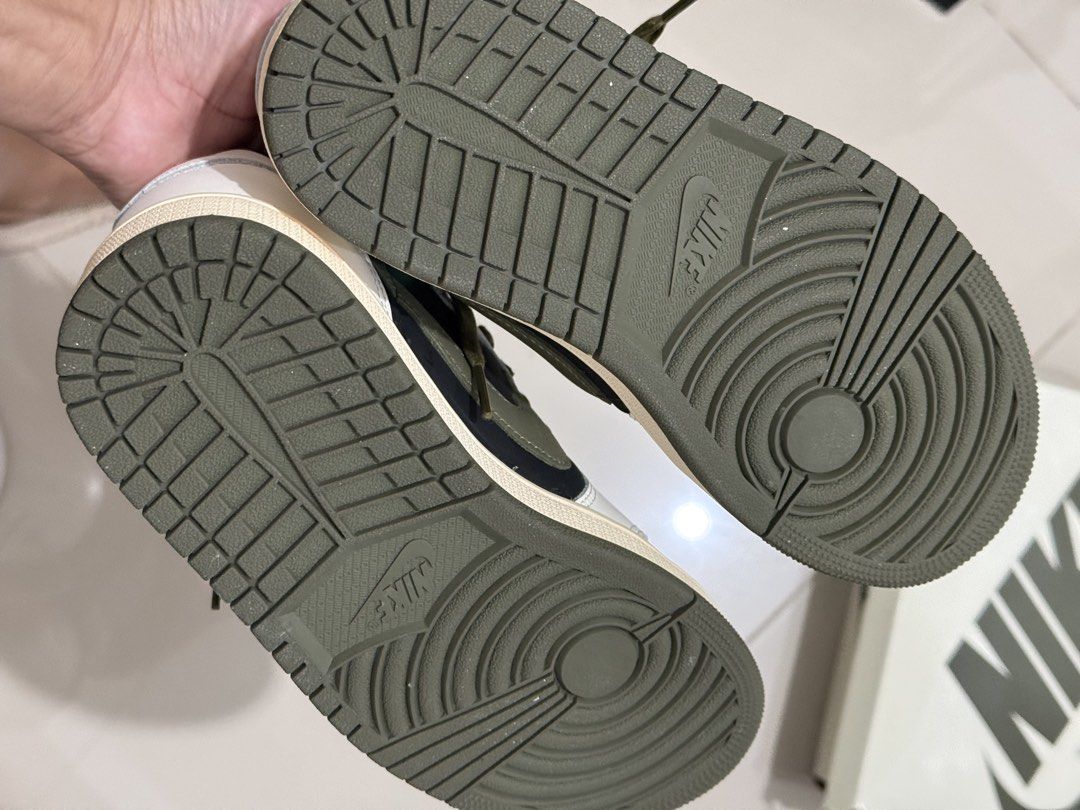 Travis Scott Jordan 1 Low OG Medium Olive (Category: Sneakers) located in Quezon City. Submitted by vvandko (Listing ID 1469531929, Image 3). Description: Used once! Size 5.5 Womens Authentic! Bought in HK EC kicks store 🇭🇰 Includes extra laces in separate bags and original box packaging. Clean soles! .