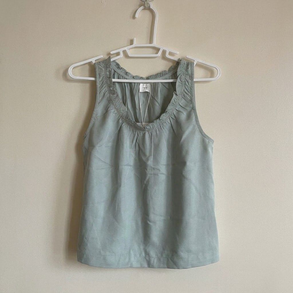 TRT Sleveless Frill Blouse in Mint (Category: Blouses) located in Legazpi City. Submitted by veilistics (Listing ID 1469448310, Image 1). Description: BRAND NEW W/ TAG bought in Singapore ❌ sensitive dm “mine” to claim exclusive of sf rfs: decluttering.