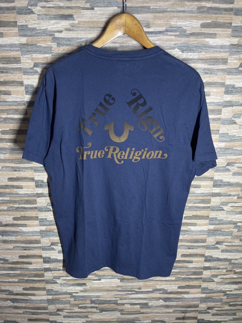 True Religion Triangle Tshirt Navy blue and gold (Category: Tshirts & Polo Shirts ) located in Cabuyao City. Submitted by randelwru (Listing ID 1469443442, Image 2). Description: True Religion Triangle Tshirt Navy blue and gold Size Large Width 21 Length 28 Excellent Condition 450🏷️Pesos Cabuyao Laguna📍.