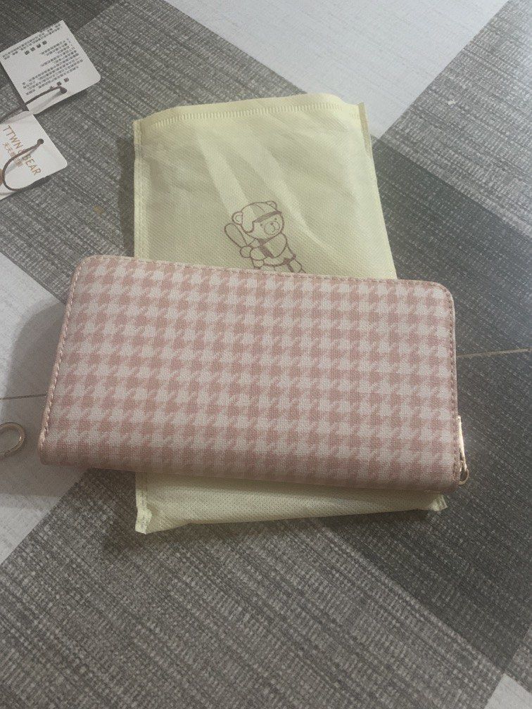 TTWN & BEAR Pink Houndstooth Long Zip Wallet (Category: Wallets & Card holders) located in Bocaue. Submitted by bajiborgy08 (Listing ID 1469522773, Image 2). Description: - Brand: TTWN & BEAR - Design: Pink houndstooth pattern with cute teddy bear graphic - Hardware: Gold-tone with bear-shaped zipper pulls - Interior: Multiple card slots, cash compartments, and zippered coin pocket - Inclusions: Matching wrist strap, original tags, and dust bag -