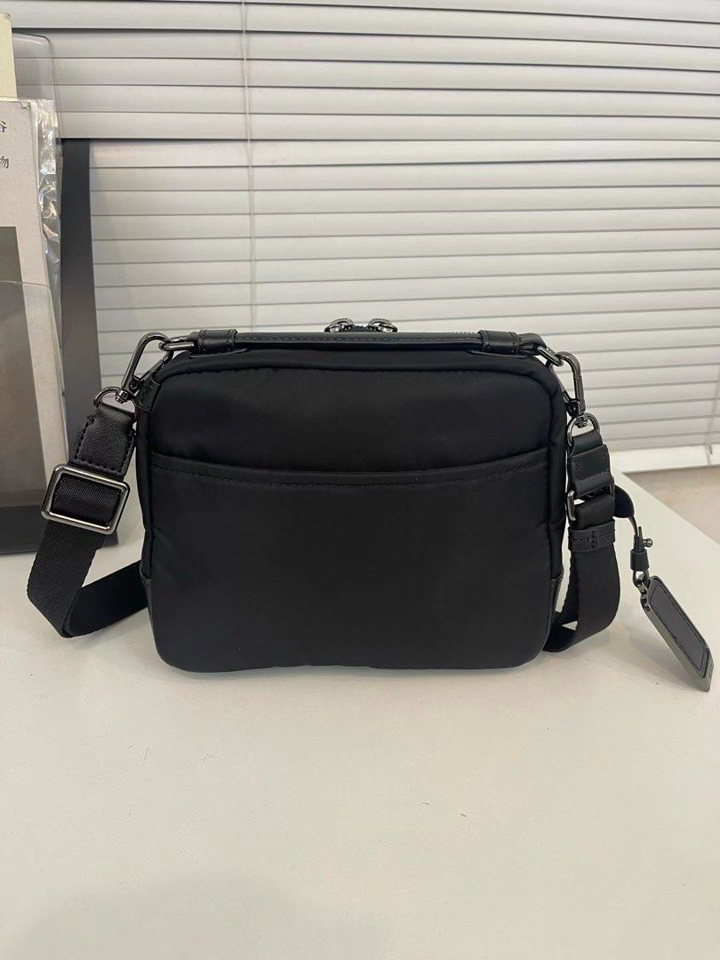 Tumi Teghan Crossbody (Category: Cross-body Bags) located in Manila. Submitted by bagmaniaph (Listing ID 1469480981, Image 2). Description: DESCRIPTION Meet the Teghan Crossbody, a classically compact style. This casual carry features a dimensional quilted pattern on black nylon, accented with silver hardware..