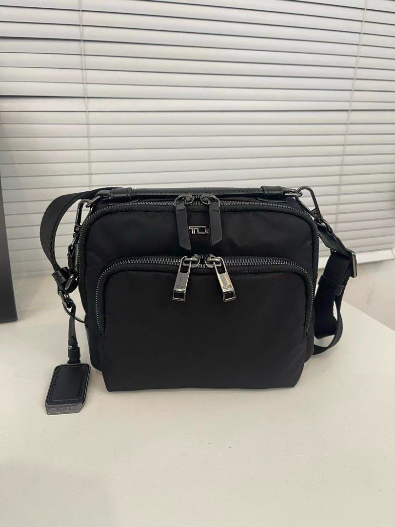 Tumi Teghan Crossbody (Category: Cross-body Bags) located in Manila. Submitted by bagmaniaph (Listing ID 1469480981, Image 1). Description: DESCRIPTION Meet the Teghan Crossbody, a classically compact style. This casual carry features a dimensional quilted pattern on black nylon, accented with silver hardware..