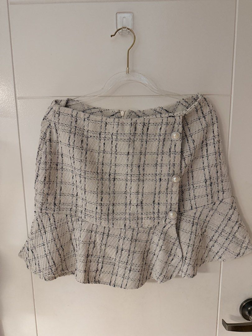 Tweed Peplum Skirt (Category: Skirts) located in Quezon City. Submitted by gorgeousghie (Listing ID 1469518255, Image 1). Description: - Cream and black tweed fabric pattern - Elegant off-shoulder neckline - Three decorative faux pearl buttons on front flap - Flattering flared peplum hemline - Secure zipper closure at the back.