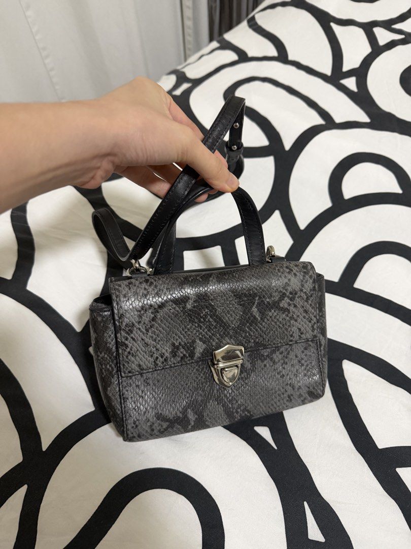 Two Toned Sling Bag (Category: Cross-body Bags) located in Caloocan City. Submitted by christineproject.ph (Listing ID 1469557299, Image 2). Description: Small size. Could only fit small phone and slim card holder. Perfect for casual occasions .