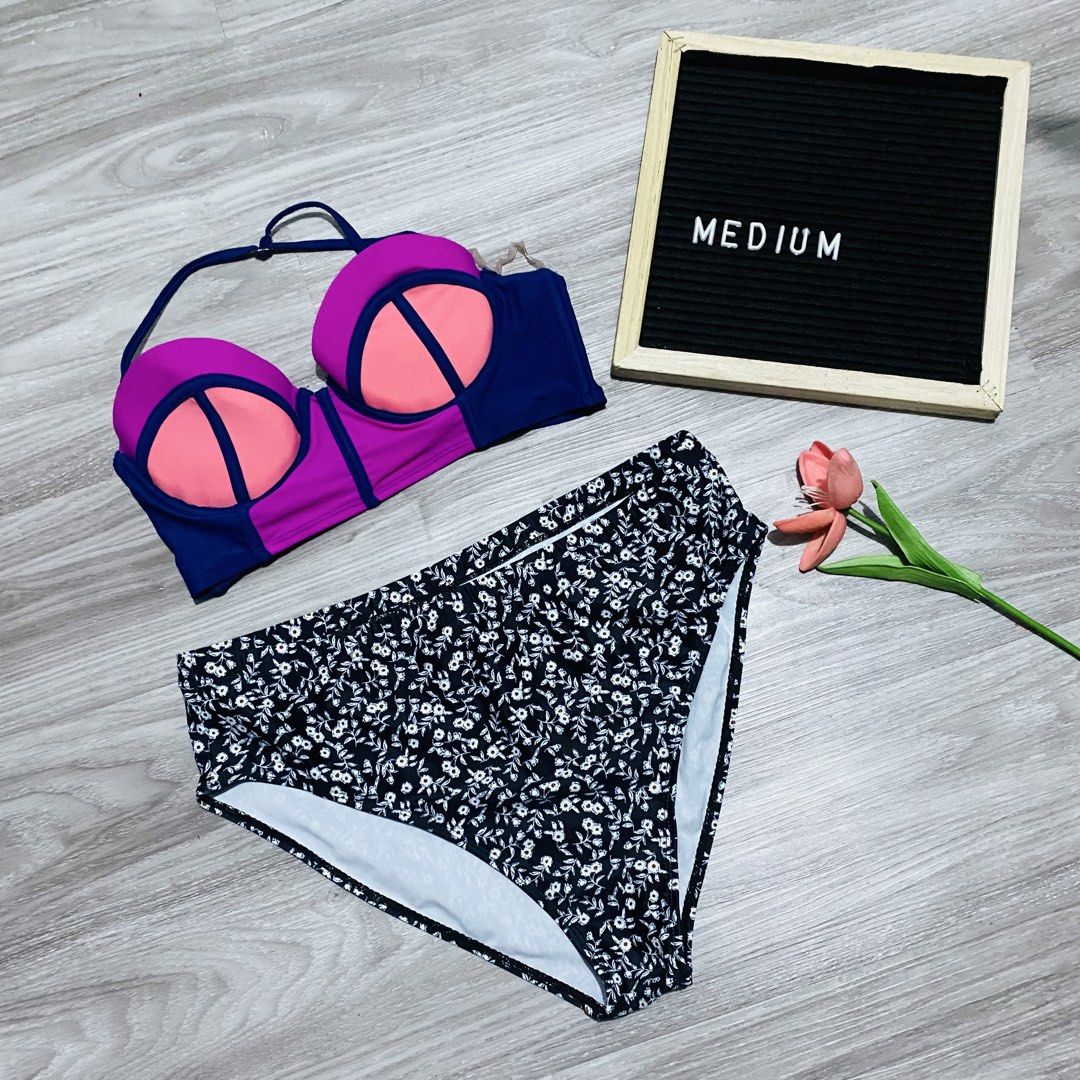 Two-Piece Swimsuit Bikini Set (Category: Bikinis & Swimsuits) located in Caloocan City. Submitted by lovemyclothes21 (Listing ID 1469497371, Image 1). Description: - Color block swim top with vibrant pink, orange, and blue panels - Features underwire support cups - High-waisted bikini bottoms in a black and white floral pattern - Size: Medium - Ready for the beach or pool.
