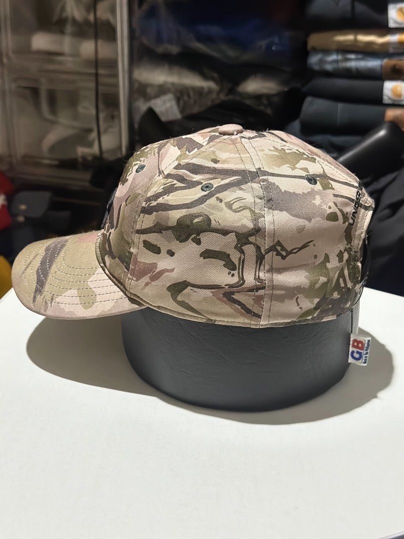 Under Armour Realtree Camo Adjustable Youth Hat (Category: Caps & Hats) located in Daet. Submitted by thrifthings2018 (Listing ID 1469482468, Image 2). Description: - Brand: Under Armour - Design: Realtree camo pattern with black embroidered front logo - Size: Youth OSFA (also fits adults), fully adjustable back strap - Material: 98% polyester, 2% elastane - Condition: Clean interior with branded taping - Origin: Made in China.