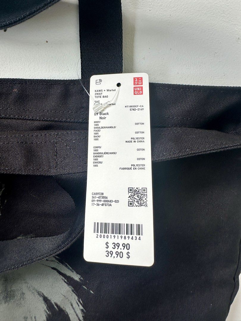 Uniqlo (Category: Tote Bags) located in Cordova. Submitted by thrifttripbyreg (Listing ID 1469439925, Image 3). Description: KAWS + Warhol x Uniqlo 2-Way Tote Bag in black..