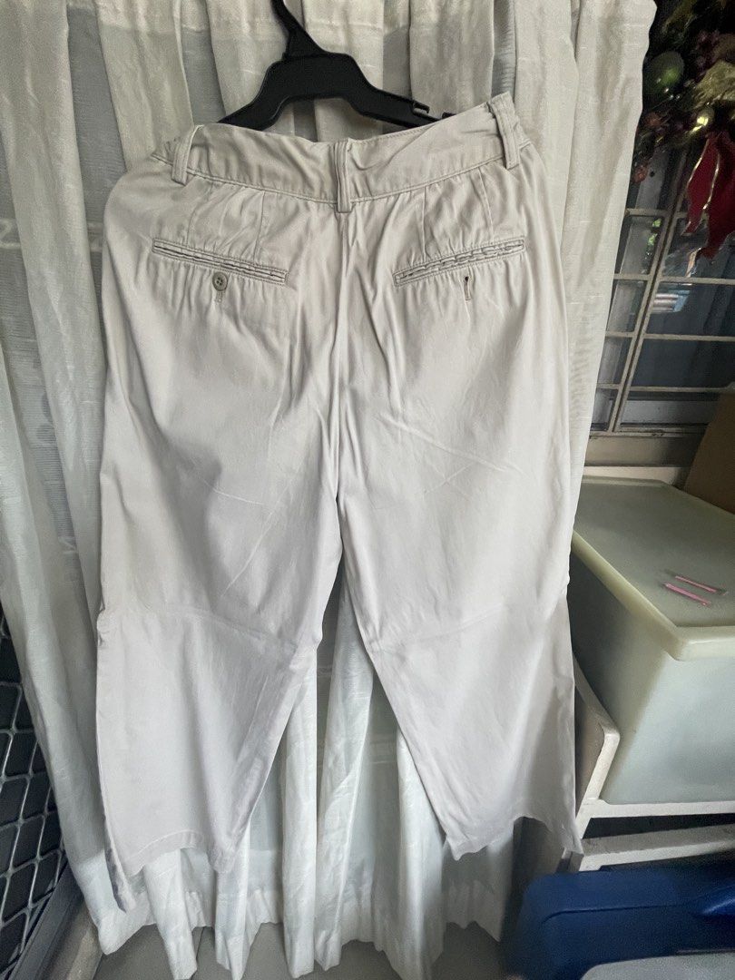 Uniqlo Beige Pants (Category: Trousers) located in Mandaluyong City. Submitted by coolmeybab (Listing ID 1469459356, Image 2). Description: - Brand: Uniqlo - Color: Beige - Size: Waist 64cm / Hip 91cm - Material: Cotton and spandex (with stretch) - Closure: Zipper fly with button - Pockets: Two back welt pockets with button detail - Condition: Clean and ready to wear.